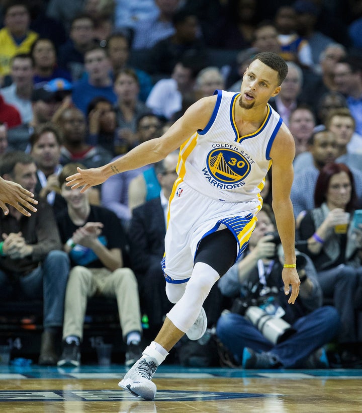Curry celebrates after scoring a second-half basket during Wednesday's game against the Charlotte Hornets.