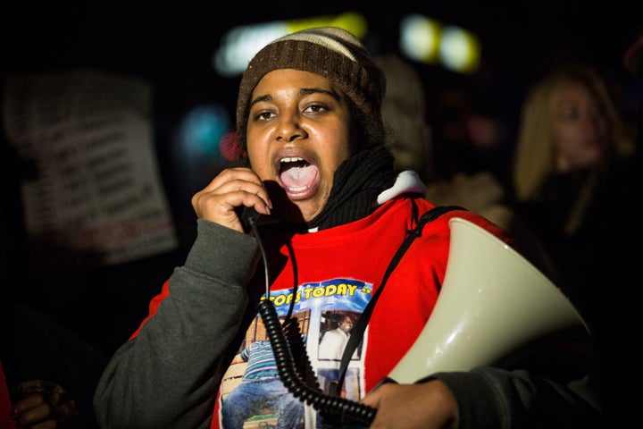 In December 2014, Erica Garner, daughter of Eric Garner, leads a march of people protesting the Staten Island, New York grand jury's decision not to indict a police officer involved in the chokehold death of her father.