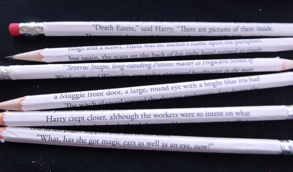 Get the <a href="https://www.etsy.com/listing/213487616/made-to-order-book-page-wrapped-pencils">book page-wrapped pencils</a