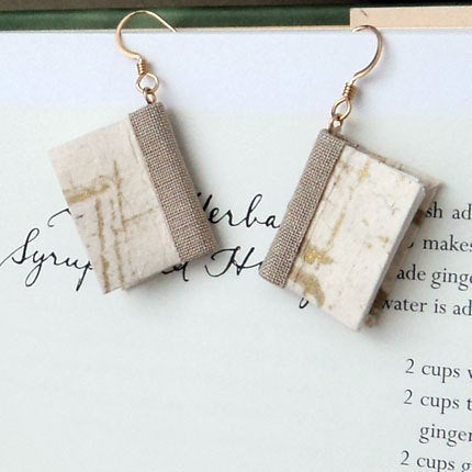 Get the <a href="https://www.etsy.com/listing/170887496/mini-book-earrings-gold-brushstrokes">Mini Book Earrings</a>.