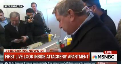 NBC News correspondent Kerry Sanders flipping through photographs he showed on live TV. 