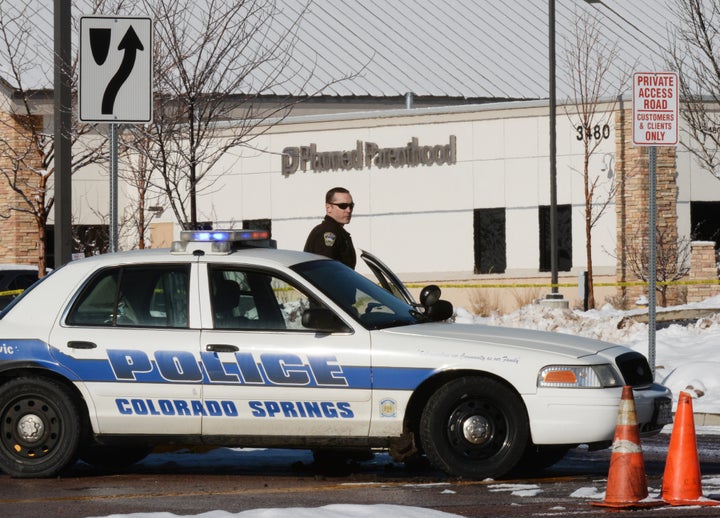 A Colorado Springs Police officer guards the entrance to the Planned Parenthood where a shooting occurred on Nov. 30, 2015. While most Americans say attacks like the one that happened at the clinic are wrong, some also say abortion is just as bad.