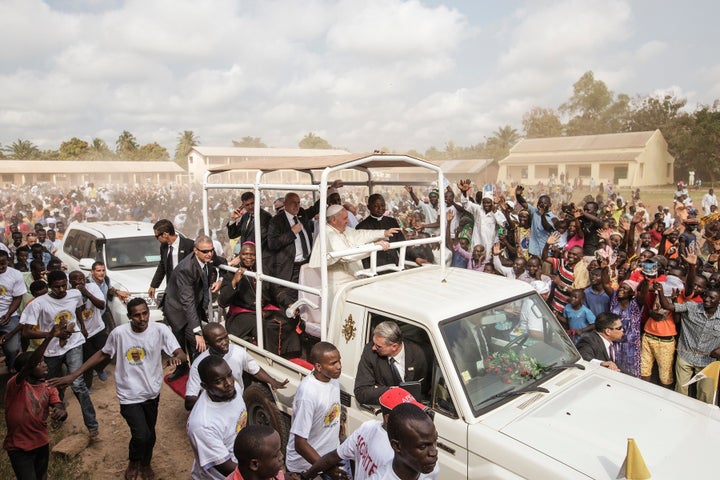 Pope Francis waves as he leaves the Central Mosque in the PK5 neighborhood in Bangui.