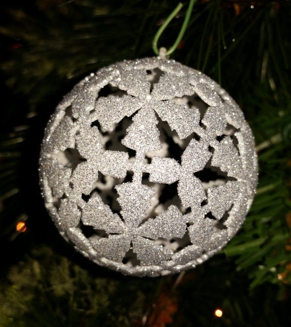 An InterfaithLiving Christmas ornament that features both trees and dreidels.