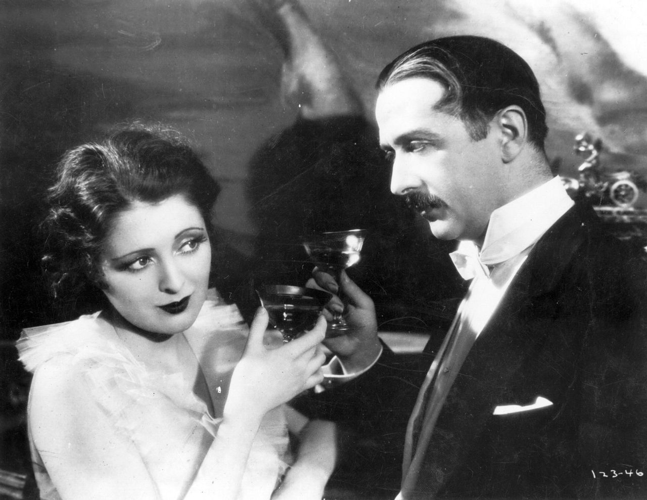 American actress Billie Dove in 1927 drinking champagne in a scene from the film 'American Beauty', directed by Richard Wallace for First National.