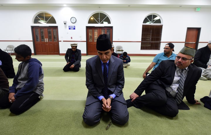 Members of the Ahmadiyya Muslim Community pray at the Baitul Hameed Mosque in Chino, California on December 3, 2015, where people attended a prayer vigil to commemorate lives lost a day after the tragedy in San Bernardino.