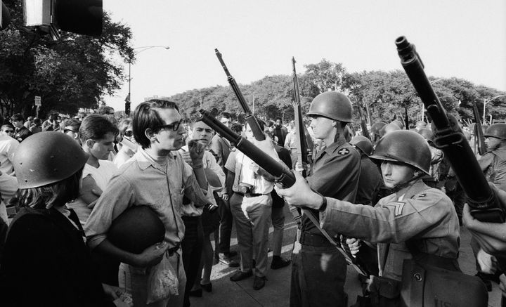 Protesters face off with armed National Guardsmen during the Democratic National Convention in Chicago in August 1968.