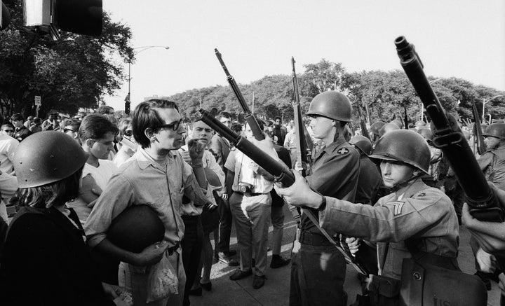 Protesters face off with armed National Guardsmen during the Democratic National Convention in Chicago in August 1968.