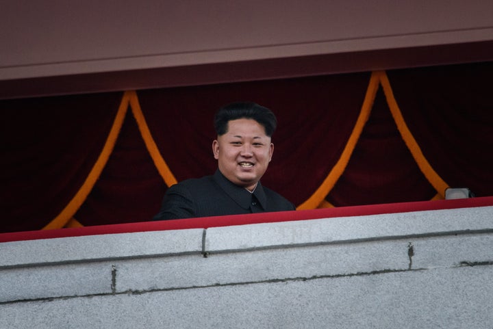 North Korea's leader Kim Jong-Un looks out towards Kim Il-Sung square during a mass military parade in Pyongyang on October 1