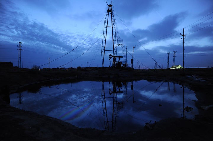 Oil rigs dominate the skyline at an oil field outside the Azerbaijan's capital Baku.