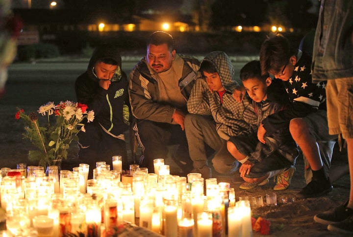 Mourners visit a makeshift memorial near the Inland Regional Center on December 4, 2015 in San Bernardino, California.