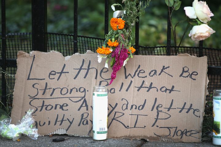 A memorial sits on the edge of the sidewalk outside the Uptown Baptist Church near where the victims of the shooting fell on Aug. 21, 2013 in Chicago, Illinois.