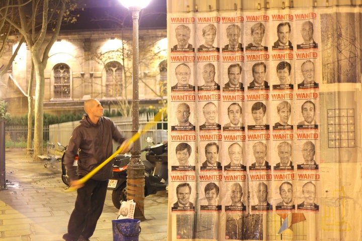 Avaaz's wanted posters go up in Paris during the COP21 conference.