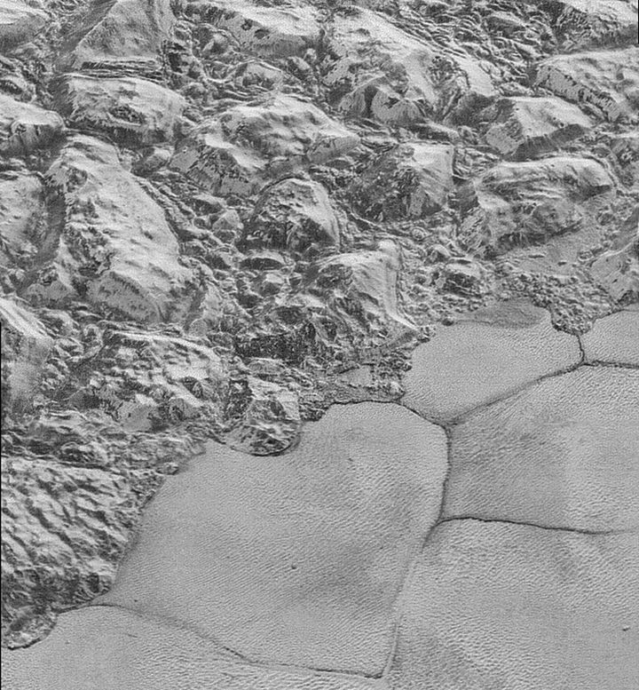 This highest-resolution image from NASA's New Horizons spacecraft shows great blocks of Pluto's water-ice surface that appear jammed together in the informally named al-Idrisi Mountains.