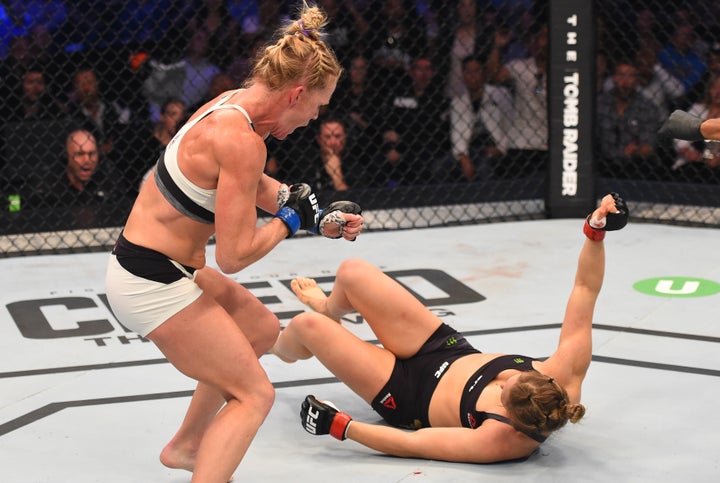 Holm follows up after knocking down Ronda Rousey during UFC 193.