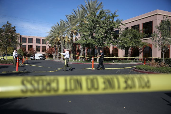 Officials put up police tape in front of the building at the Inland Regional Center were 14 people were killed on Dec. 2 in San Bernardino, California. A new poll finds Americans are more worried about terrorism than gun violence.