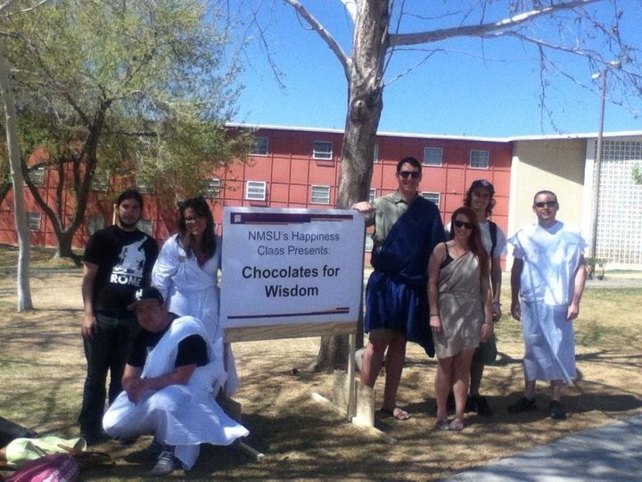 Each year, the students in Mark Walker's happiness class at New Mexico State University organize "Chocolates for Wisdom," a day where they dress in togas and ask people on campus what they believe about happiness and the "good life."