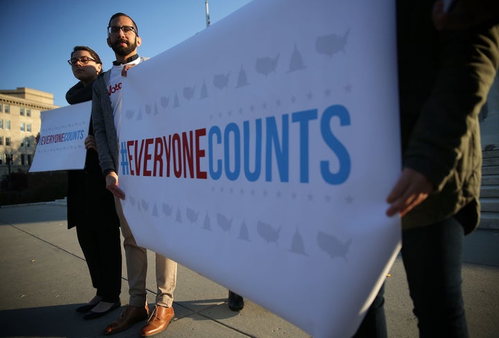 Voting rights activists demonstrated outside the Supreme Court on Tuesday, as the justices considered arguments in two redist