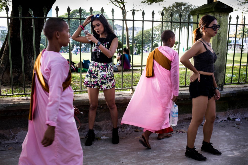 Ah Moon and her dancer take a break during filming in downtown Yangon.