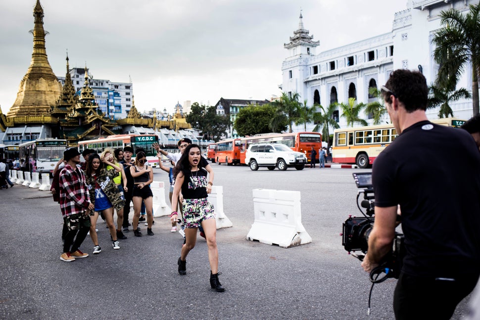 Ah Moon and her dancers film a music video in front of the ancient stupa the Sule Pagoda in downtown Yangon.