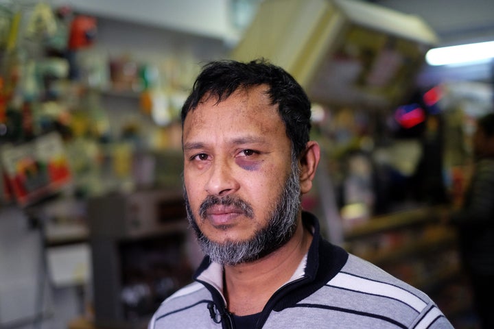 Muslim shopkeeper Sarkar Haq, who was beaten in an alleged hate crime, speaks during an interview at his shop in New York on Dec. 7.