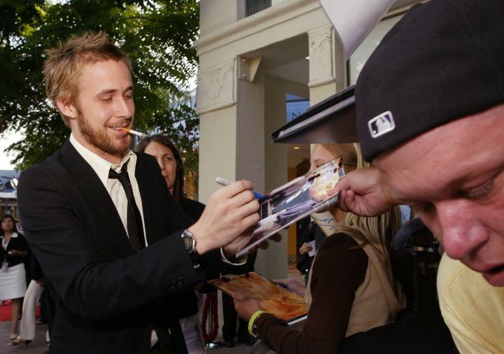Ryan Gosling signs an autograph at the 2004 premiere of "The Notebook."