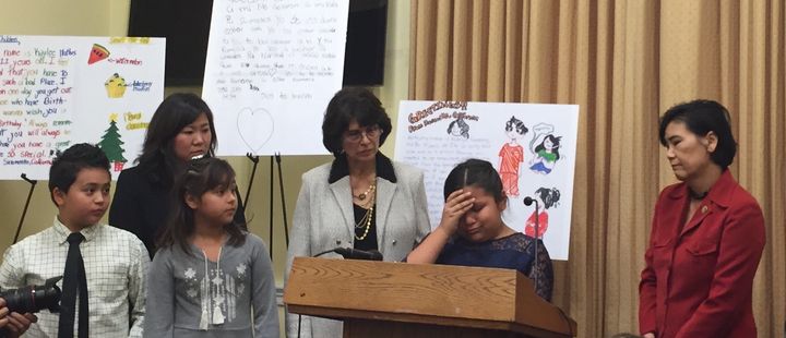 Nine-year-old Fiorella Zuniga, flanked by California Reps. Lucille Roybal-Allard (left) and Judy Chu (right), began to cry at a press conference Wednesday while talking about her fear that her mother will be deported.