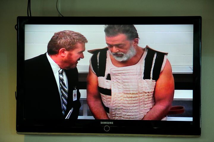 Robert Dear (right) appears with public defender Dan King (left) in his first court appearance in this photo from Nov. 30. In his second court appearance, Wednesday, Dear loudly proclaimed his guilt and had several outbursts.