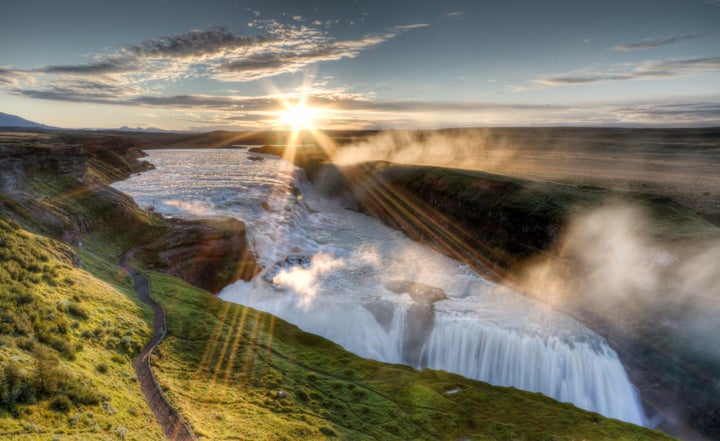 Mighty Hvítá river cascading at dawn over gullfoss waterfall in Southwest Iceland.