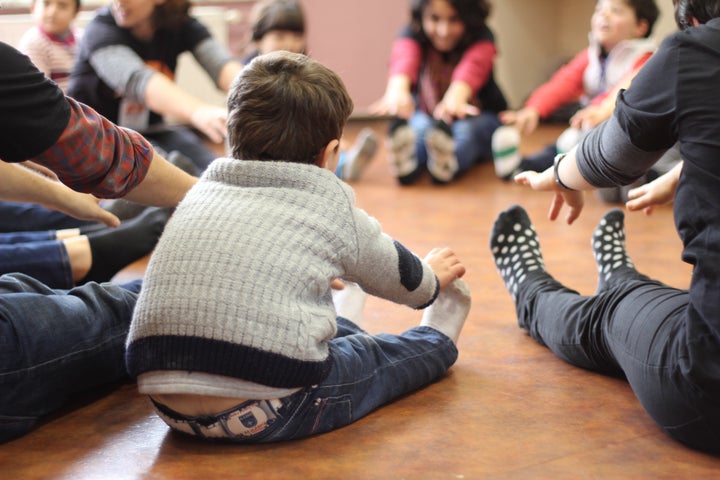 Syrian refugee children take part in a dance and movement exercise at a Project Lift workshop. 