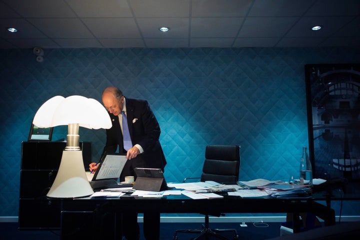 French Foreign Affairs minister Laurent Fabius works in his office during the COP 21 United Nations Conference on climate change.