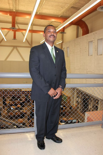 San Bernardino City Unified School District Police Chief Joe Paulino stands in an atrium at the Arroyo Valley High School, where a former student who is suing the district was arrested in November 2012. Paulino said heâs now working to drive down his officersâ arrests of minors.