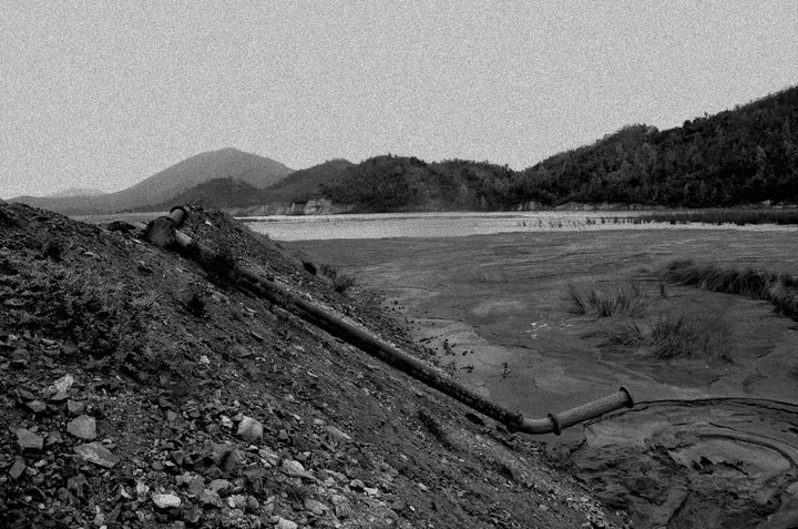 Pipes carry nuclear waste into the dam.