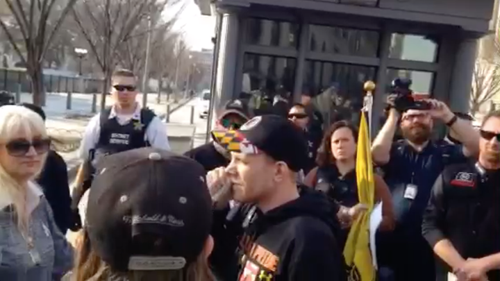 Ed Speiger (center), an anti-Muslim activist, speaks into a megaphone at a rally outside the White House that was overwhelmed by anti-racist counter-protesters.