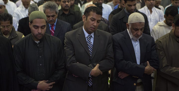 Mohammed Hameeduddin, pictured standing in the center here in 2012 as Teaneck mayor, says the Muslim community needs more organizations to mentor people who want to run for higher office.