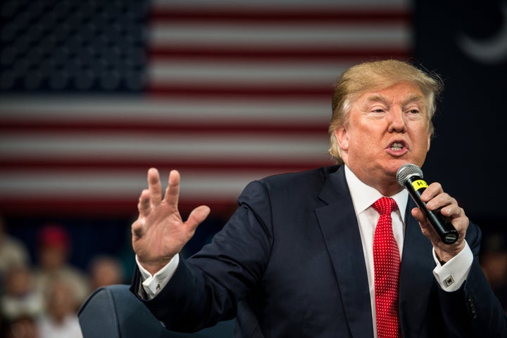 Republican presidential candidate Donald Trump speaks to the crowd at a town hall meeting Dec. 12, 2015, in Aiken, South Carolina. A new HuffPost/YouGov poll finds Americans are still divided on whether he's a serious candidate.