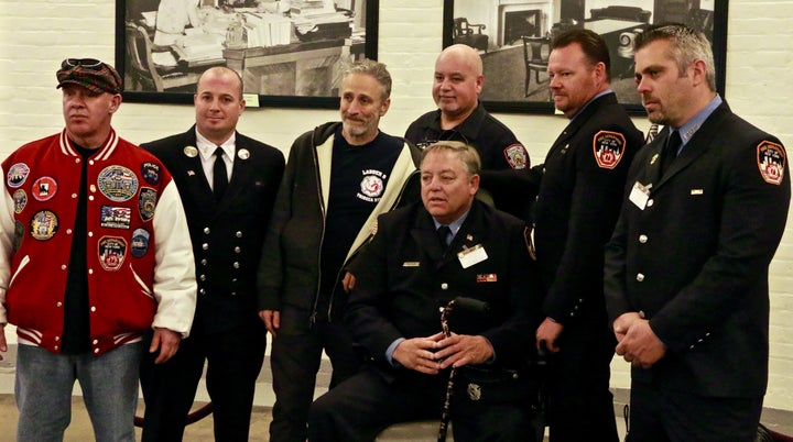 John Feal, Michael Connor, Jon Stewart, Ray Pfeifer, Richard Palmer, Kenny Specht and Keith Delmar in the basement of the Russell Senate Office Building in Washington, D.C.