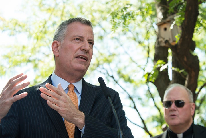 Bill de Blasio addresses the press. Mayor Bill de Blasio and Cardinal Timothy Dolan (not seen) joined with city and state off