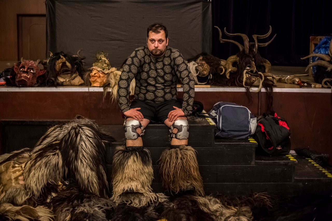 A Krampus reveler gets ready for a parade in the Czech Republic.