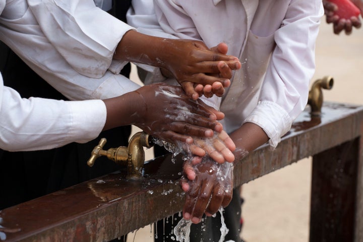 JOHANNESBURG, SOUTH AFRICA - OCTOBER 15: Children learn to wash their hands with Lifebuoy soap, at Margeret Gwele Primary School, Soweto, on October 15, 2012 in Johannesburg, South Africa.