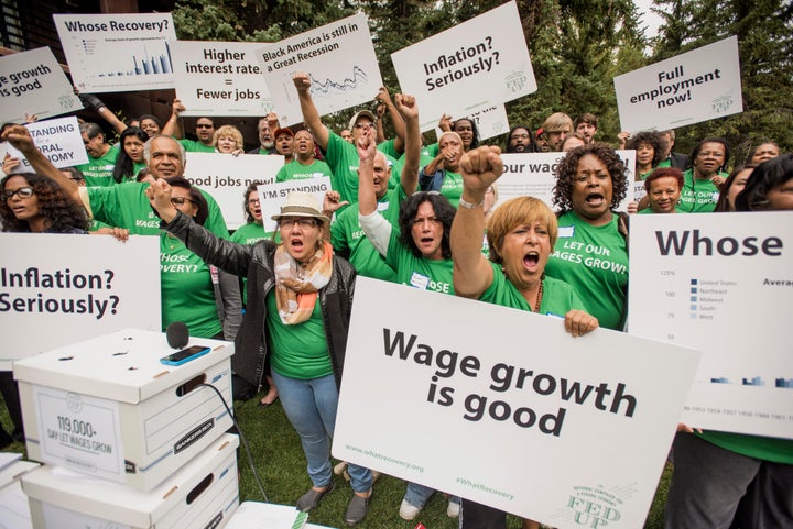 Members of the Fed Up campaign, a coalition of progressive groups opposed to an interest rate hike, demonstrate at the Jackso