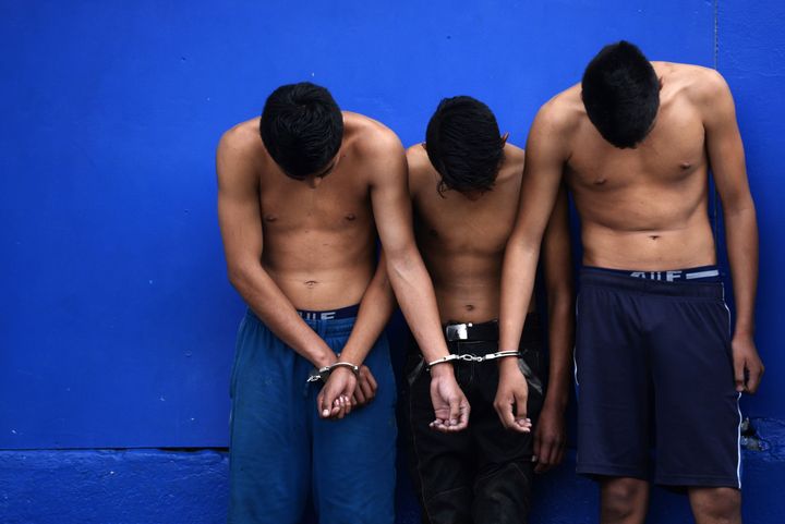 Suspects accused of several crimes are presented to the media after an operation in search of 18th Street gang members hidden in a mountainous area in Ayutuxtepeque, 4 km north of San Salvador, on October 25, 2015. After an intense shootout between police and alleged gang members, three young people were killed and others four were captured while carrying three rifles M16 and one AK-47, ammunition and military clothing.