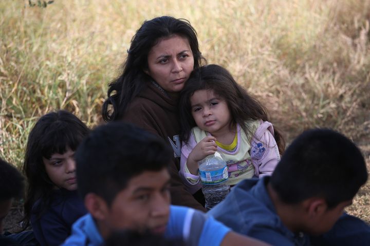 A Honduran mother holds her daughter, 3, after she turned her family in to U.S. Border Patrol agents on December 8, 2015 near Rio Grande City, Texas.