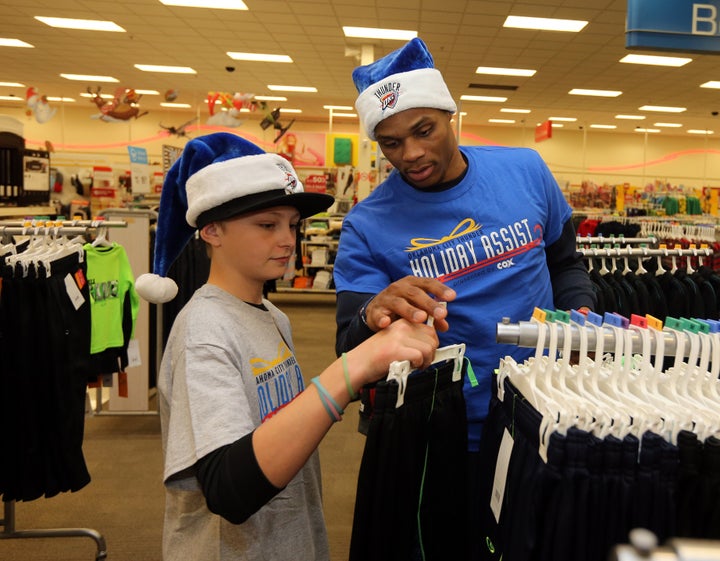 Westbrook doing other service work for the Oklahoma community earlier this week. In this picture, he's assisting families from the Sunbeam Family Services Grandparents Raising Grandchildren program.