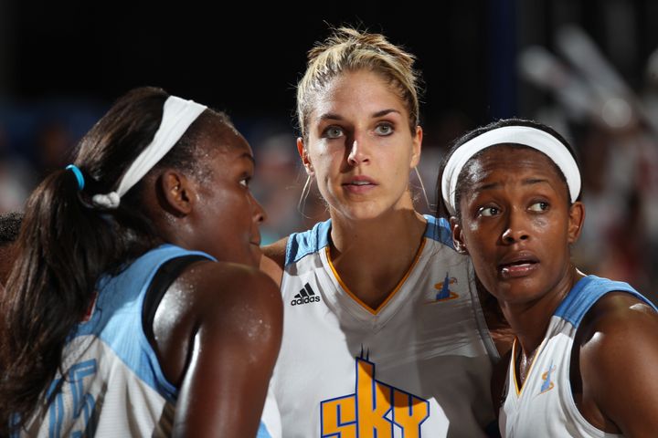 Elena Delle Donne (center) talks with teammates Michelle Campbell (left) and Swin Cash (right) during a timeout in the Chicago Sky's game against the Los Angeles Sparks on June 29, 2013.