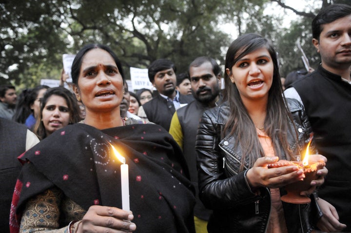 Protestors hold a candle march on the third anniversary of the attack. Releasing Jyoti Singh's identity was seen as a challenge against an article of India's penal code, which forbids naming rape victims.