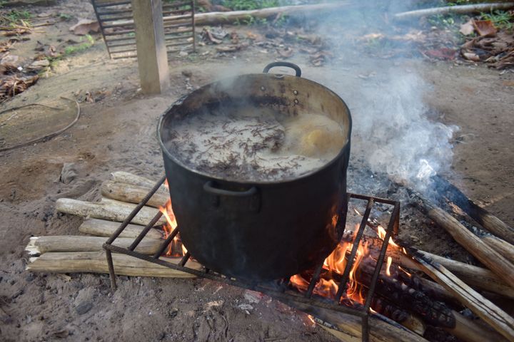 The ayahuasca plant brew is seen here being cooked over a wood fire