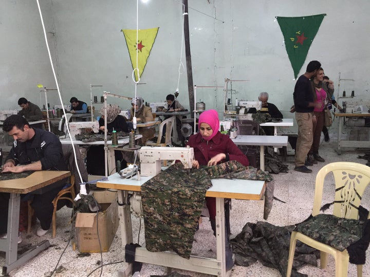 A Rojava sewing cooperative in Derik, Rojava, Syria, in December 2014. Workers are sowing uniforms for the Syrian Kurds' militia, the YPG.