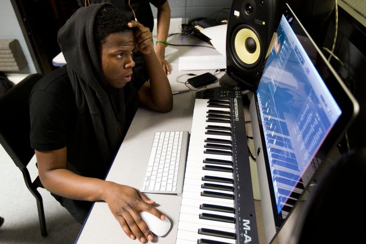 Strawberry Mansion High School student Zalmir Deputy at work in the recording studio Drake donated to the school.
