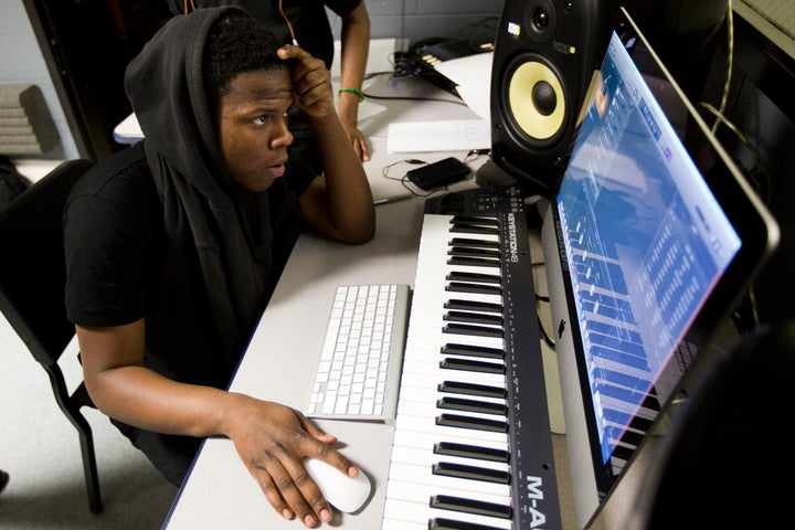 Strawberry Mansion High School student Zalmir Deputy at work in the recording studio Drake donated to the school.